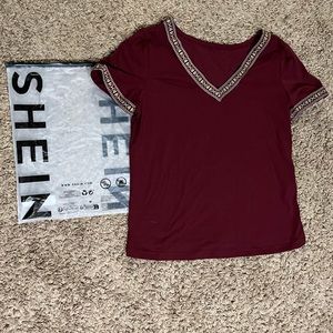 SHEIN Burgundy Tee with cute designs on collar & Sleeves. NWT